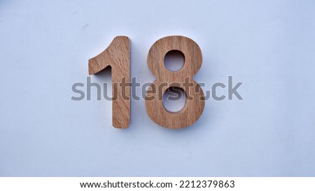 wooden 3d number eighteen , selected focus on white background
