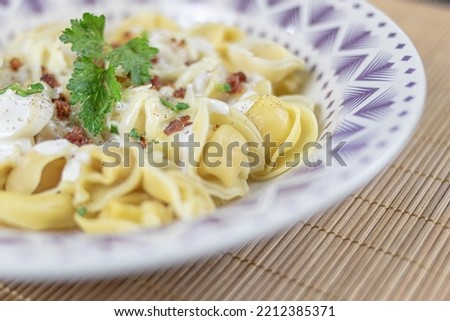 Italian pasta dish, capeletti in white sauce
