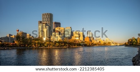 Calgary's beautiful skyline on early morning in the heart of autumn with fall colours on the trees. Royalty-Free Stock Photo #2212385405