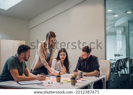 Professional project managers group negotiating in boardroom at meeting. Boss discussing with creative team the concept of business strategy in their project. Fun at work. Copy space. Royalty-Free Stock Photo #2212387671
