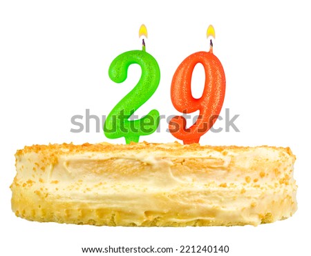 birthday cake with candles number twenty nine isolated on white background