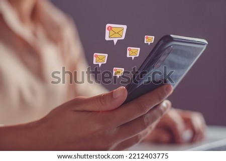 Close-up of  woman hand checking email in mailbox on mobile phone.