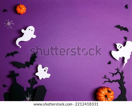 Halloween composition with cemetery, ghosts, spiders and other scary on purple background. Happy halloween banner mockup. Flat lay, top view, copy space.