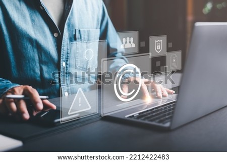 Business people work through laptops, concepts of copyright or intellectual property patents, piracy protection, proprietary representation, legitimate innovations and inventions, patent campaigning. Royalty-Free Stock Photo #2212422483