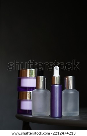 Mockup of beauty cosmetic makeup bottle serum dropper product with skincare healthcare concept in dark background