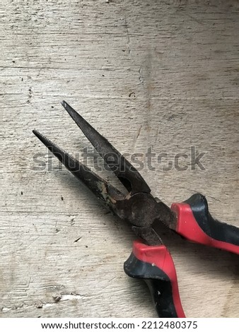 Image of Pliers with Wood background