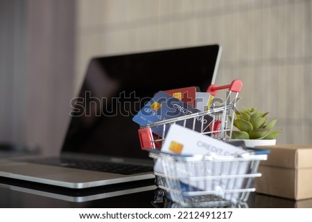 Picture of credit card and laptop computer. making online shopping online. Online shopping concept. Payment Transaction at Computer using Credit Card