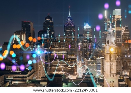 Aerial panoramic cityscape of Philadelphia financial downtown at summer night time, Pennsylvania, USA. Glowing forex candlesticks and bar graph hologram. The concept of internet trading and brokerage