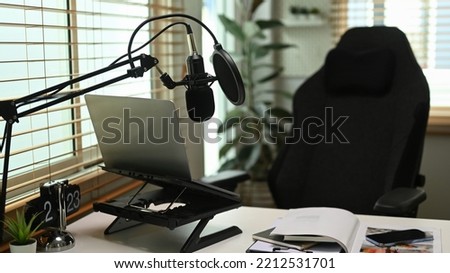 Home studio with laptop and condenser microphone. Entertainment, podcasts and technology concept