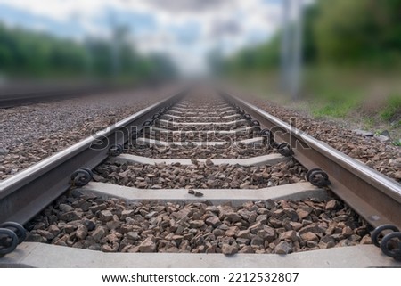 Railway lines closeup. Train tracks with track ballast stones, metal rails, railway track Royalty-Free Stock Photo #2212532807