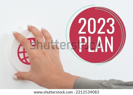 Text caption presenting 2023 Plan. Conceptual photo setting up your goals and plans for the current year or in 2023