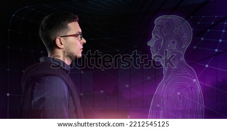 Young man with his digital projection on dark background. Concept of digital twin Royalty-Free Stock Photo #2212545125