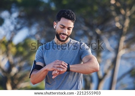 Runner with fitness smart watch, app and check running time for health tracking tech on nature run. Sports athlete doing workout practice for cardio wellness, physical fitness and marathon training Royalty-Free Stock Photo #2212555903