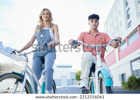 City travel, bicycle and couple friends portrait for outdoor summer, youth wellness lifestyle. gen z woman or people with bike cycling for carbon footprint, date or free time together in urban street