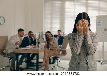 Woman suffering from toxic environment at work Royalty-Free Stock Photo #2212566783