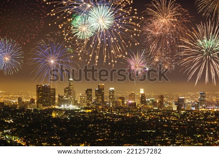 Downtown Los angeles cityscape with flashing fireworks celebrating New Year's Eve. Royalty-Free Stock Photo #221257282