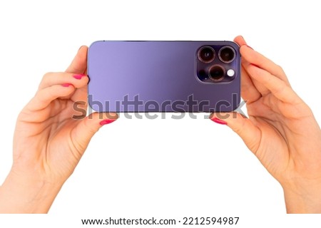 Person holding mobile phone in both hands, isolated on white background