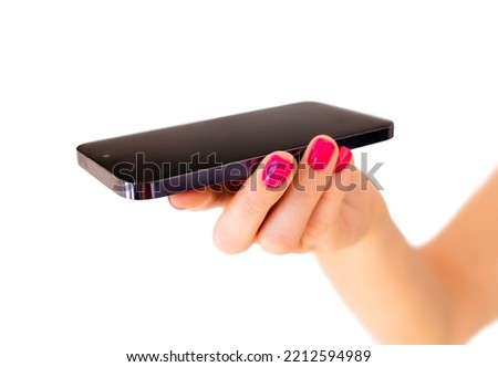 Person holding mobile phone in palm with screen flat upside, isolated on white background
