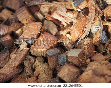 Macro view of coconut coir or the byproduct from coconut shell husk cut in small pieces for potting mix usage Royalty-Free Stock Photo #2212645501