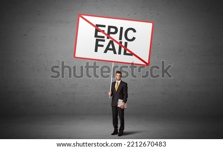 business person holding a traffic sign