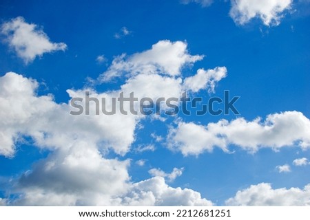 White clouds against blue sky.