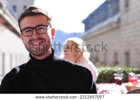 Elegant man wearing turtle neck sweater and classic eyeglasses  Royalty-Free Stock Photo #2212697097