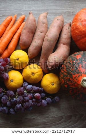 Various healthy autumnal food on wooden table. Top view.