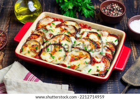 Baked eggplant with cheese mozzarella and tomatoes. Healthy eating. Vegetarian food. Italian food. Royalty-Free Stock Photo #2212714959