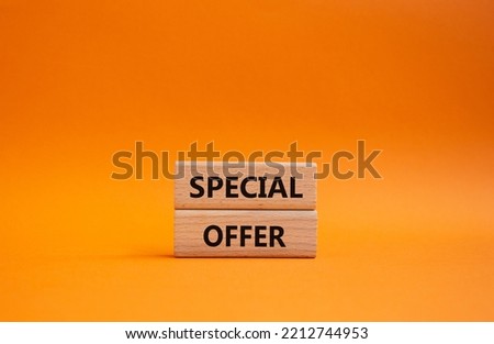 Special offer symbol. Concept word Special offer on wooden blocks. Beautiful orange background. Business and Special offer concept. Copy space