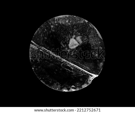 transparent adhesive round plastic sticker label isolated on black background