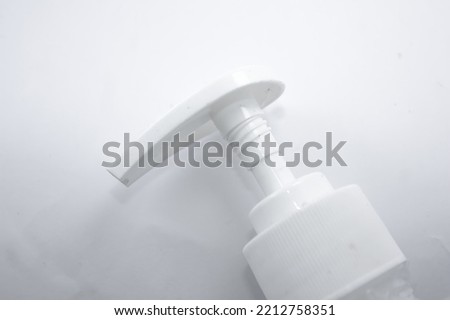 The pump of hand sanitizer bottle in white background