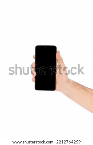Hand holding mobile phone and blank screen for mockup template advertising and branding technology background.