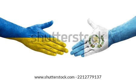Handshake between Guatemala and Ukraine flags painted on hands, isolated transparent image.