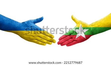 Handshake between Myanmar and Ukraine flags painted on hands, isolated transparent image.
