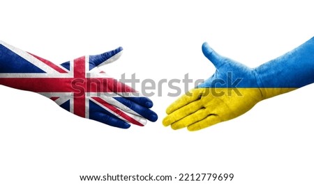 Handshake between Ukraine and United Kingdom flags painted on hands, isolated transparent image.