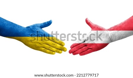 Handshake between Austria and Ukraine flags painted on hands, isolated transparent image.