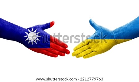 Handshake between Taiwan and Ukraine flags painted on hands, isolated transparent image.