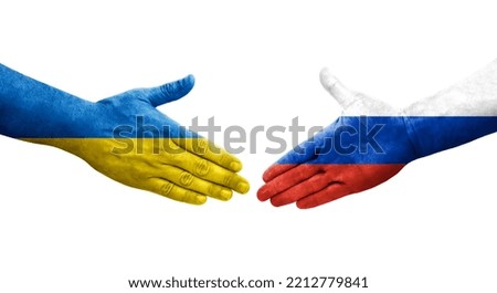 Handshake between Russia and Ukraine flags painted on hands, isolated transparent image.