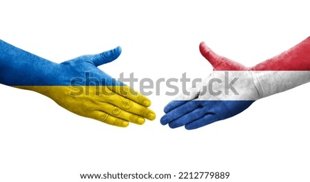 Handshake between Netherlands and Ukraine flags painted on hands, isolated transparent image.