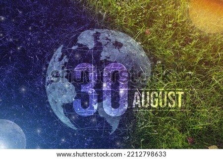 August 30th. Day 30 of month, Calendar date. Day to night background concept. Scene with globe the green grass with sun, stars, moon and calendar date.   Summer month, day of the year concept