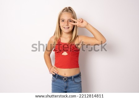 Fun joy enjoy people person fun time concept. Portrait of cute lovely carefree confident sweet adorable beautiful girl in casual modern outfit demonstrating v-sign isolated on white background