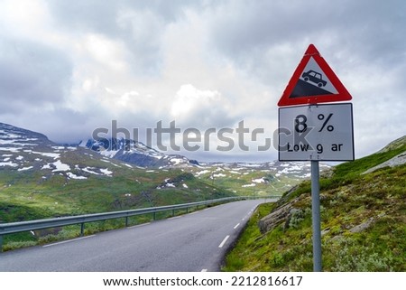 Steep hill warning sign at the Oscarshaug viewpoint along national scenic route R55 through Sognefjellet area.