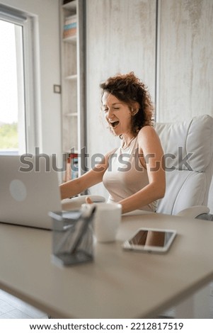 One young woman female caucasian back to work in the office working on laptop and smiling entrepreneur modern business woman concept