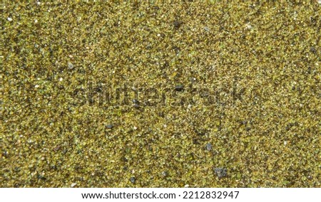 Macro photography of green sand in the Pacific.Macro photography