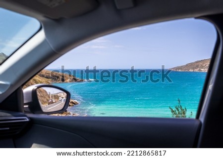 View of the sea from the car window in Arraial do Cabo. Royalty-Free Stock Photo #2212865817