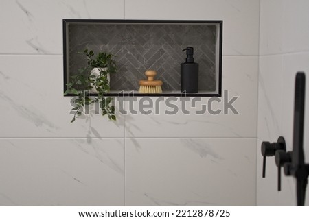 Tiled wall niche in modern bathroom. Royalty-Free Stock Photo #2212878725