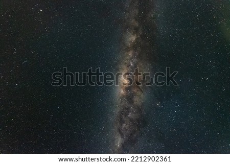 A night time photo of the Milky Way galactic core and detailed surrounding nebula against a dark starry sky in the southern hemisphere of Australia. Royalty-Free Stock Photo #2212902361