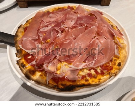 Pizza with Tomato and Ham Toppings