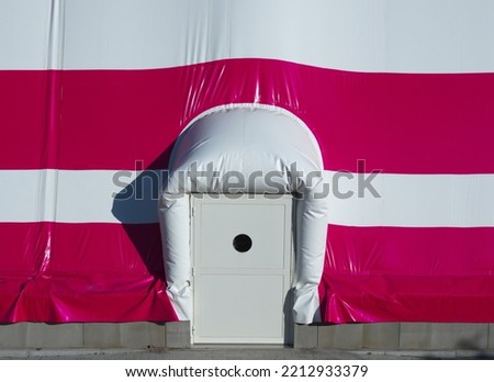 Emergency exit from inflatable air dome for football field Royalty-Free Stock Photo #2212933379