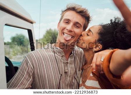 Selfie, kiss and couple taking a picture on a road trip, having fun on a traveling adventure together. Love, nature and black woman kissing man for photo, bond in romantic moment in the countryside